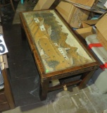 coffee table with inlaid farm scene under glass top