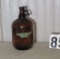 Orlando brewing amber glass jug with some type of liquid
