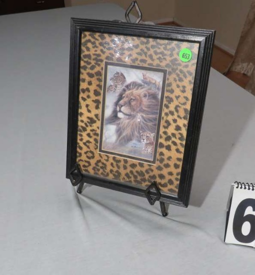 9" x 12" framed picture of lion on metal sign