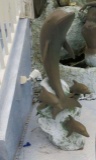 Bronze dolphin statue and water fall 41