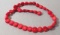 dark red strand of 36 coral beads