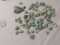 group of 60 uncut green emerald stones  Assorted shapes