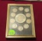 framed 1971 Ike dollar surrounded by 10 Roosevelt dimes 1967-1970