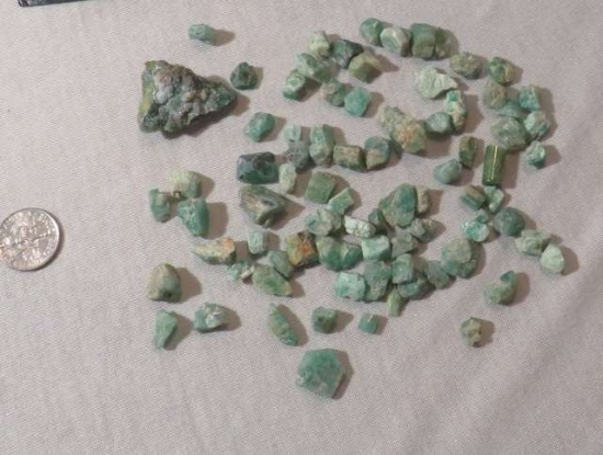 group of 60 uncut green emerald stones  Assorted shapes