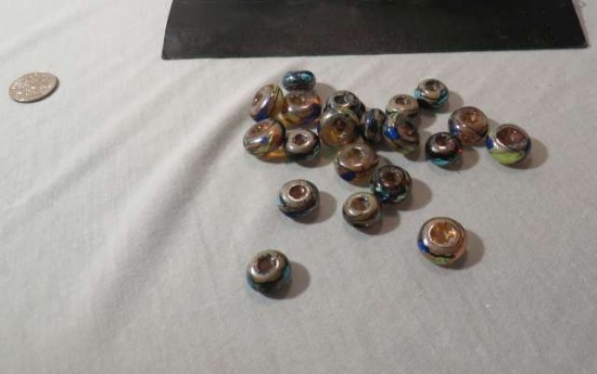 package of 21 black blue donut style assorted glass beads