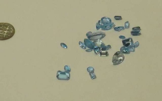 pack of 25 synthetic blue Swiss topaz Assorted shapes Assorted sizes