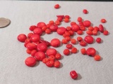 group of 60 round drilled red coral discs  Various sizes