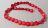 dark red strand of 36 coral beads
