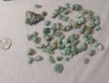 group of 60 uncut green emerald stones  Assorted shapes