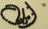pack of 71 smooth round black lava beads