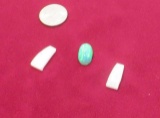 lab grown arched white trapezoid cut opal and cabochon cut green oval stone