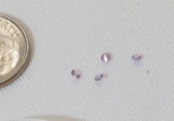 group of 4 brilliant cut small glass stones