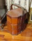 antique stacked wood hat boxes in carry rack