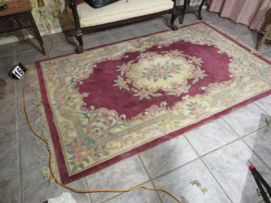 Wool rug 5' x 9' needs cleaning but appears to be in good condition
