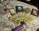 vintage folding fan, picture frames, candle stand