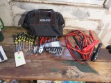emergency kit in bag includes set of end wrenches, jumper cables, screwdriver kit