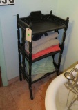 turned spindle towel shelf with towels in main bathroom