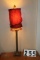 Table lamp with red cloth shade and beading, 32 inches tall