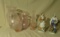 collection of 3 pieces of pink glass and 2 people figurines