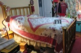 full size brass bed with bedding