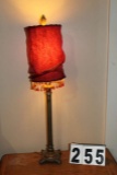 Table lamp with red cloth shade and beading, 32 inches tall