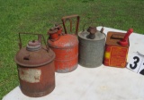 group of 4 small metal gas cans including one safety can