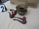 collection of old smoking pipes, brass spittoon
