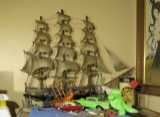 model ship and mixed toys (top of dresser bedroom 2)