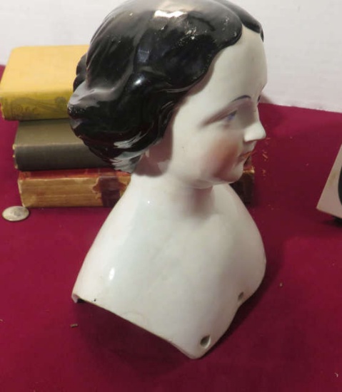 antique porcelain doll head contains provenance stating that it was saved by a young girl had to eva
