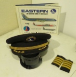 Eastern Airlines pilots hats and shoulder stripes plus illustrated book about Eastern Airline and it