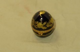 vintage ceramic cobalt egg with gold trim containing small perfume bottle