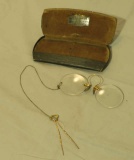 Ladie's antique gold frame spectacles in case with chain and clip for attaching to the dress or blou