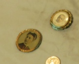 group of old photos including a metal framed young woman from the late 1800's, a small metal pin wit