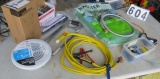mixed hardware including new water filter assembly, hacksaw, jumper cables, soldering iron, Waste Ma