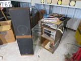 Fisher turn table, cassette player, am FM radio in cabinet with speakers, and old 33 rpm vinyl recor