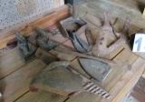 primitive cast iron pieces, cultivator sweeps, corn sheller, cobblers tools,  sat irons