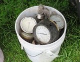 bucket of assorted water pressure gauges