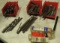 large group of taps, punches, chisels, drill bits  in red assortment bins
