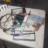 mixed tools and hardware including welding rods, torch goggles, strikers,