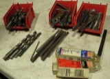 large group of taps, punches, chisels, drill bits  in red assortment bins