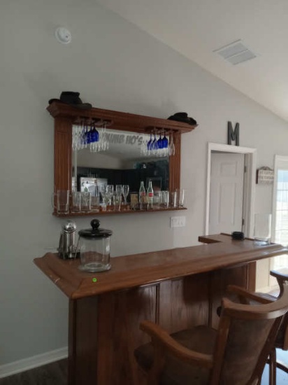 oak finished bar with back mirror wine glass rack and two heavy duty swivel bar stools with back and
