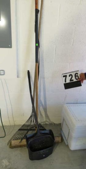 group of garage tools including rake, shop broom and large dust pan