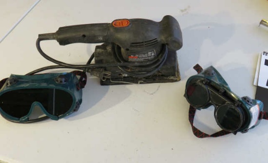 pad sander and pair safety goggles, pair welding goggles
