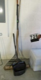 group of garage tools including rake, shop broom and large dust pan