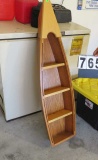replica wood fishing boat designed as a wall shelf unit