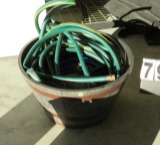 planter barrel bottom with garden hose