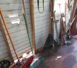 group of 16 assorted brooms and yard  tools