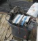 tote of mixed used outboard motor parts