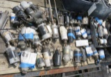 assorted used outboard motor starters, trim pumps, trim motors