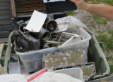 tote of mixed used outboard motor parts
